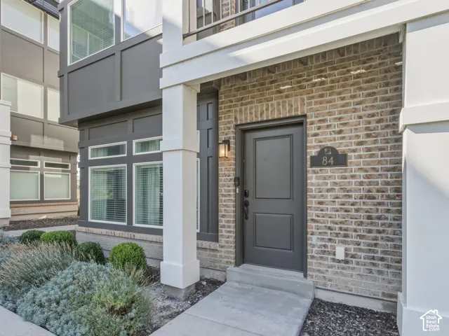 Brick facade with dark gray entry door