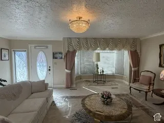 Architectural bay window, decorative leaded glass entry door, and matching sidelight panels