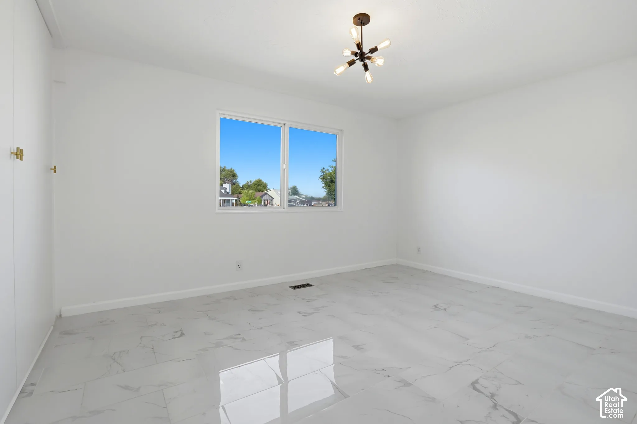 White-painted interior with a modern multi-bulb ceiling fixture