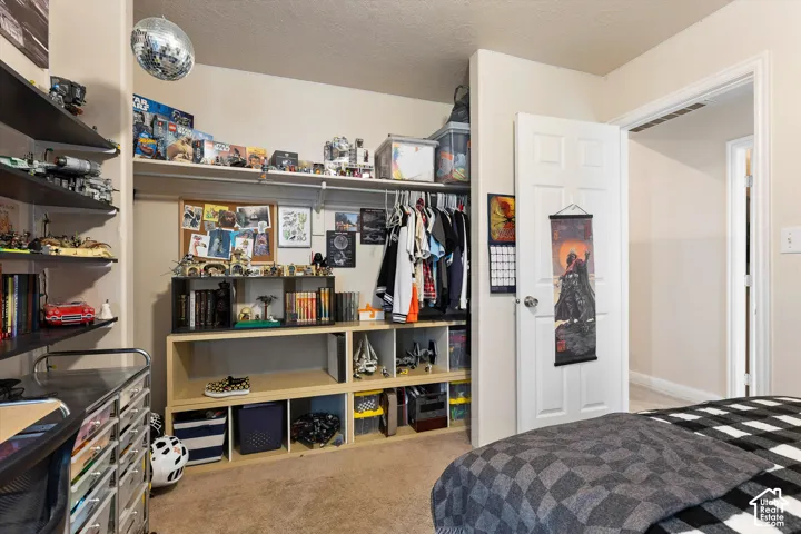 Built-in closet system with multiple shelves and hanging rods