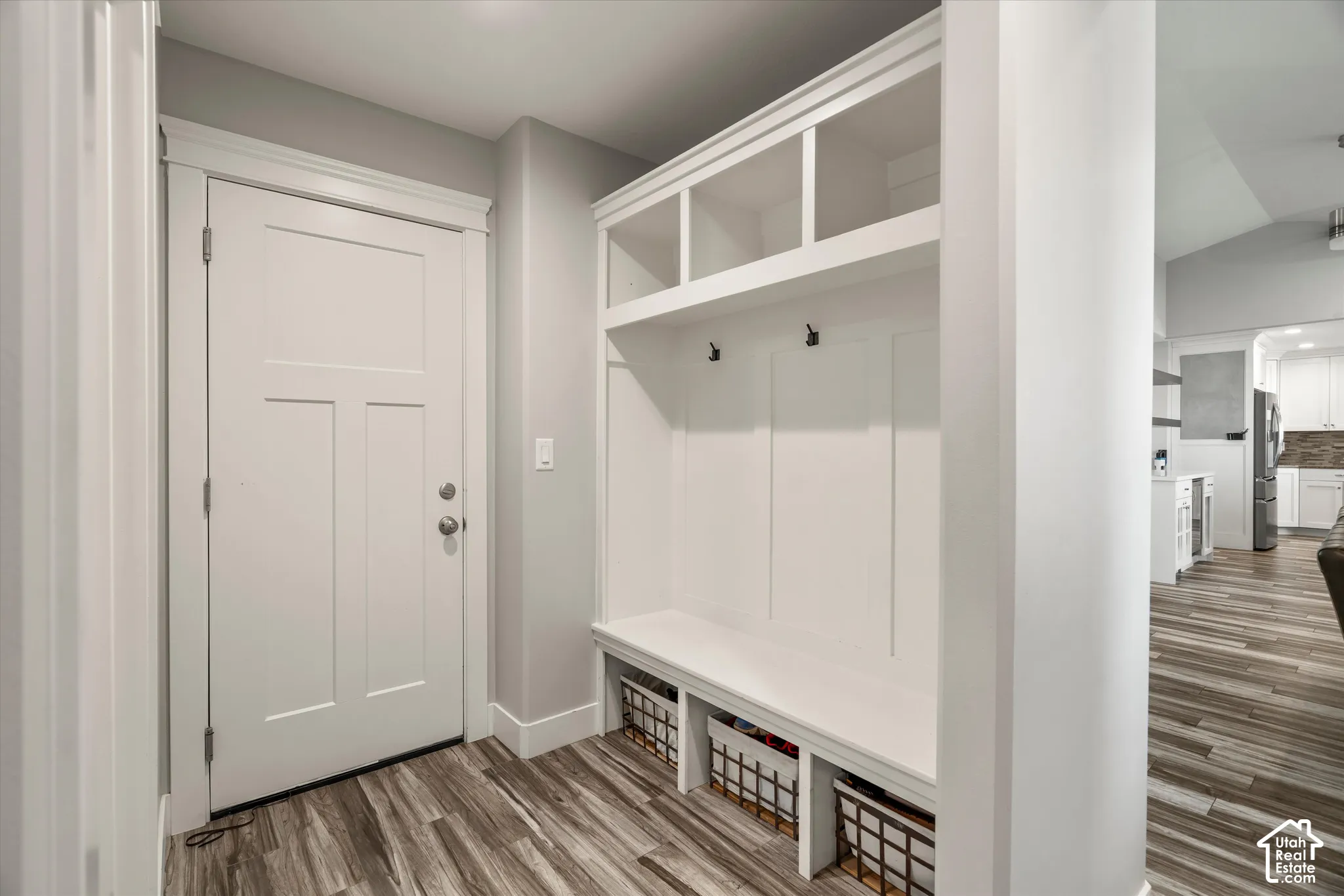 Built-in mudroom storage with integrated bench seating and overhead cubbies