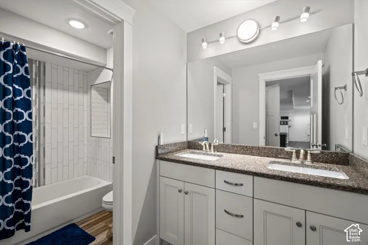 Dual vanity with integrated sinks and a stone-finish countertop