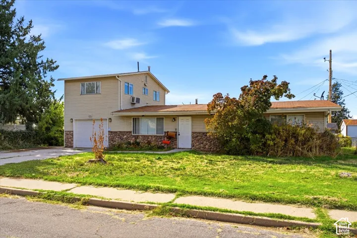 Main-level living with the studio apartment from the street view.