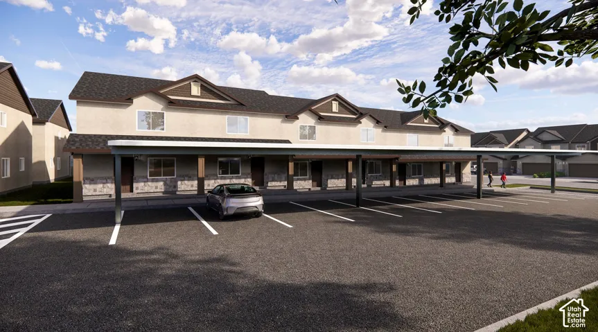 Contemporary multi-unit exterior with carport parking, stone and stucco facade, dark roof, and gabled accents