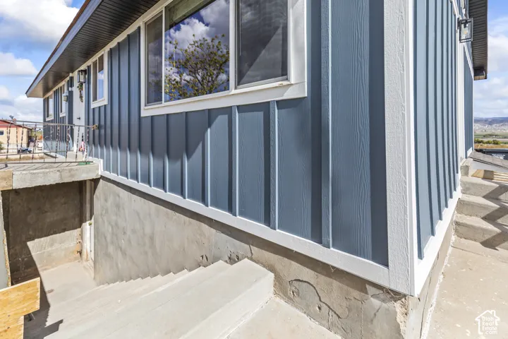 Blue board-and-batten style siding with white trim