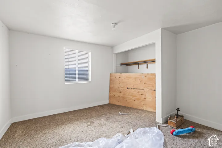 Built-in closet with shelving and hanging rod