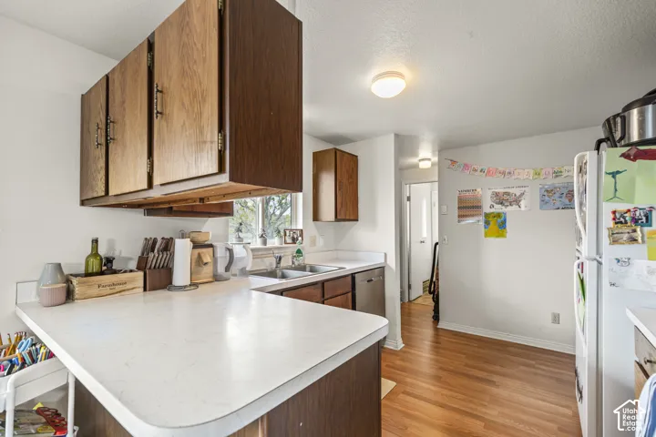 Wood-finish cabinetry paired with light-toned countertops