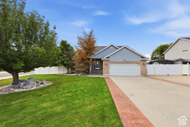 Brick and siding exterior with an attached garage