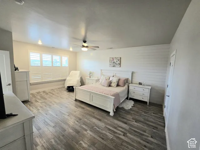Wood-finish flooring throughout, complemented by a shiplap accent wall