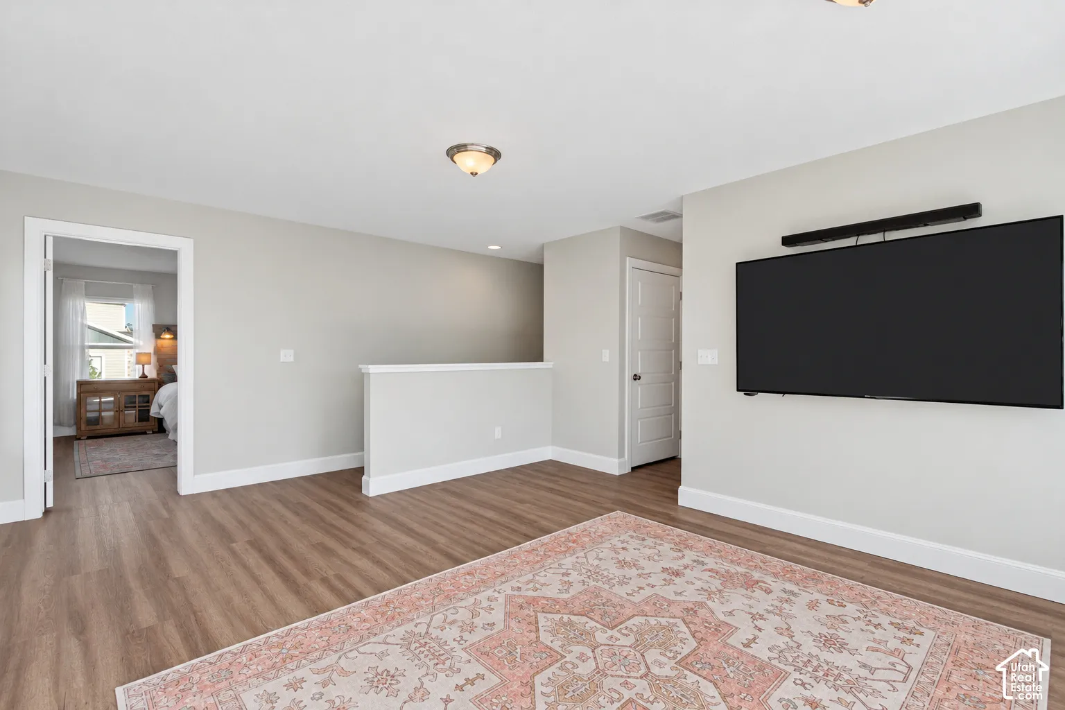 Loft area featuring LVP flooring, incredible natural light, a custom built-in window seat and mountain views