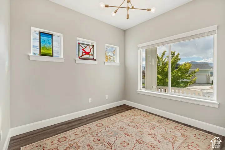 Inviting office with great natural light, large window and double glass-paneled doors