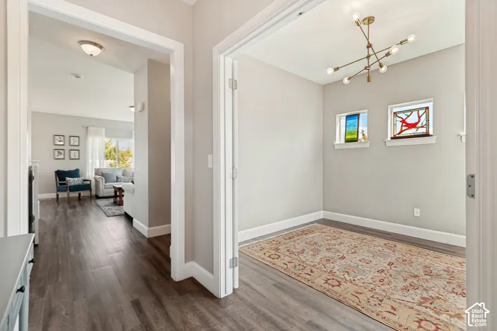 LVP flooring throughout, modern chandelier in office with great natural light