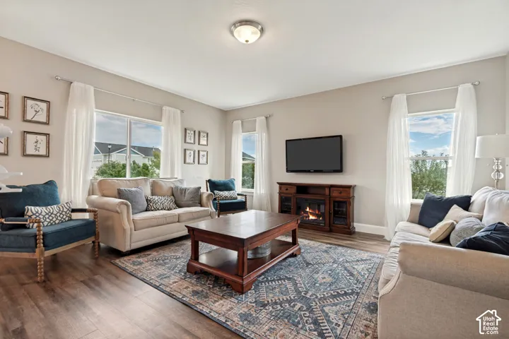Expansive living area featuring LVP flooring with great natural light