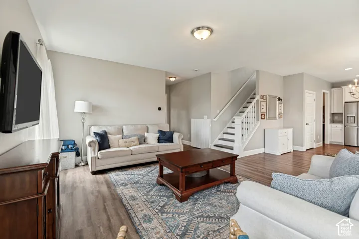 Open-concept living area featuring LVP flooring with great natural light