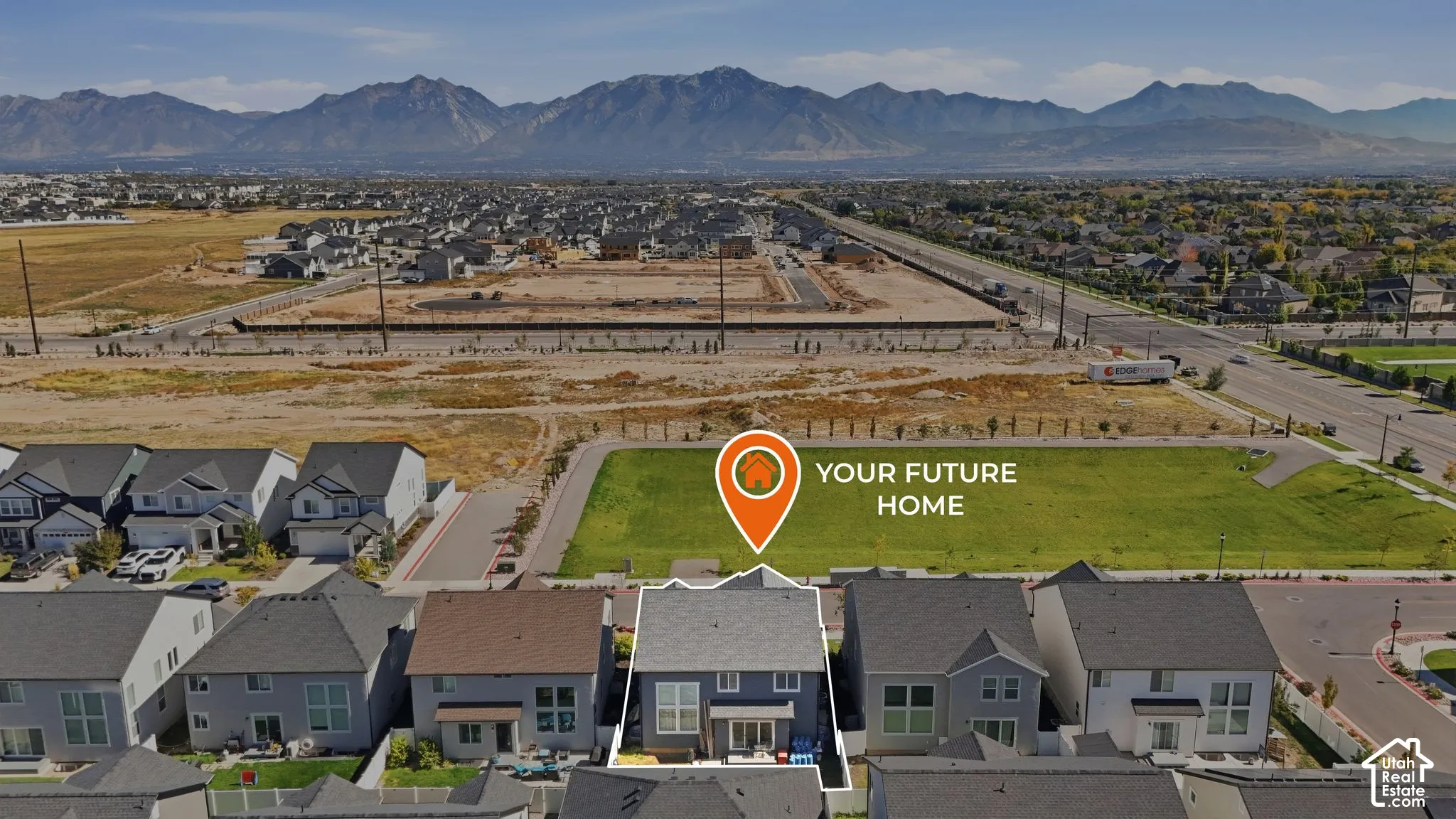 Mountain backdrop, neighborhood setting, adjacent green space, tree-lined street, two-story residence