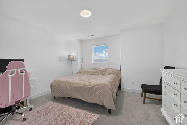 Recessed ceiling lighting, a window with blinds, and light-toned wall paint
