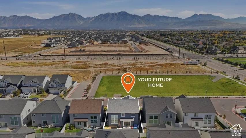 Mountain backdrop, neighborhood setting, adjacent green space, tree-lined street, two-story residence