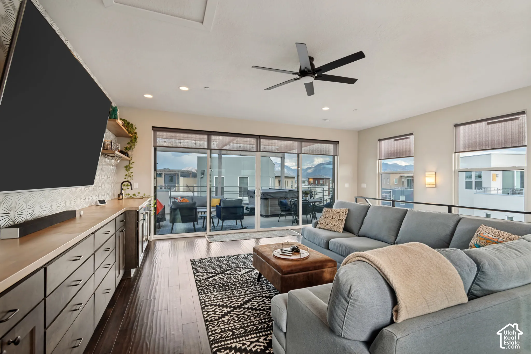 Wood-finish flooring, recessed lighting, and a modern ceiling fan