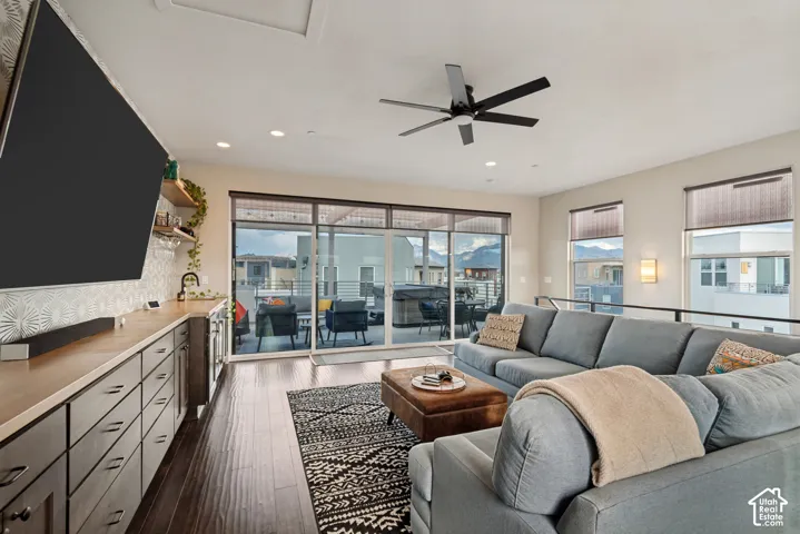 Wood-finish flooring, recessed lighting, and a modern ceiling fan