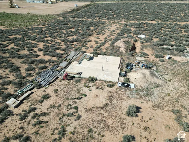 Expansive desert parcel featuring a concrete foundation and native vegetation