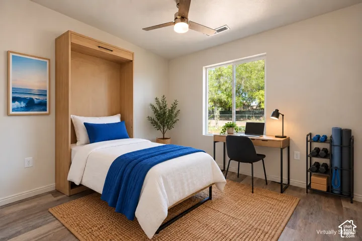 Bedroom 2  wood-finish flooring, and ceiling fan with integrated lighting