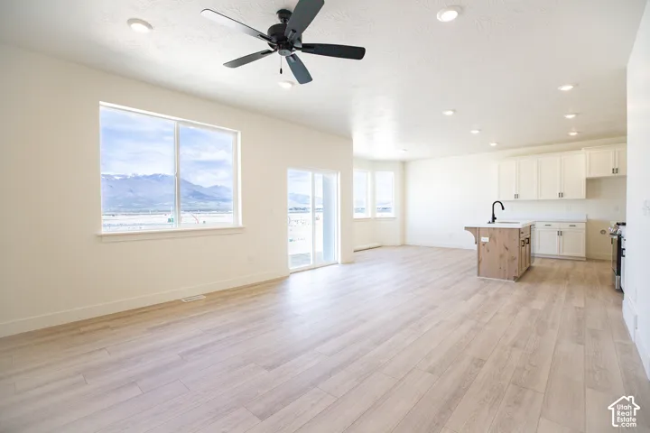 Open dining area with great windows in a breakfast nook form adjacent to the kitchen.