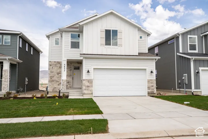 Ash Elevation C with front yard landscaping installed.