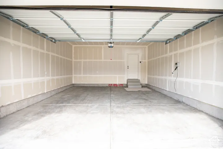 Two-car garage with taped finish.