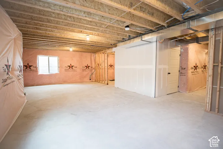 Unfinished basement with potential for large family/game room, full bathroom and one bedroom.