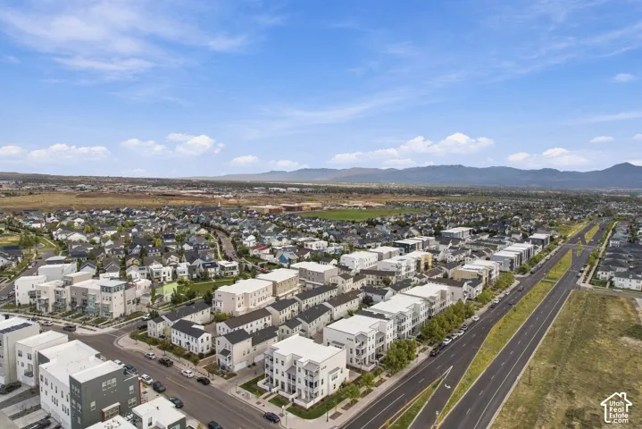 Expansive residential area with multiple street thoroughfares and distant mountain scenery