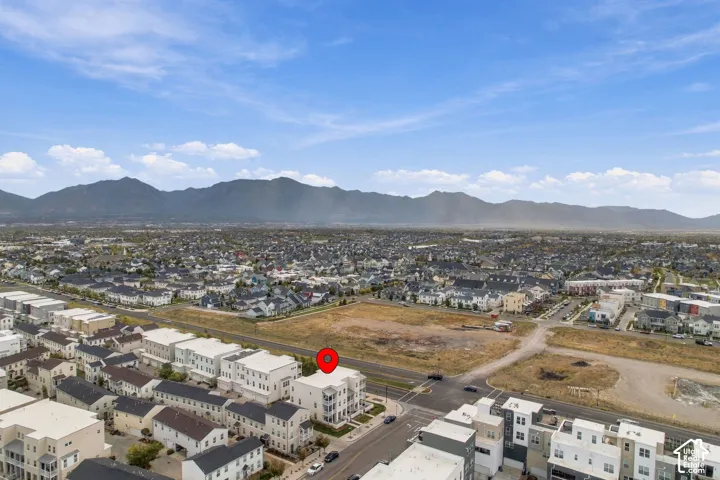 Expansive mountain backdrop with a dense residential area