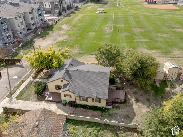 Two storage sheds, extensive decking, and a paved side yard
