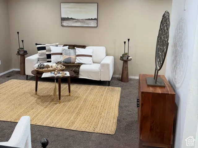 Interior space featuring neutral wall paint, recessed lighting, and wall-to-wall carpeting