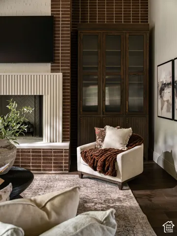 Brick wall accent with recessed fireplace and herringbone firebox