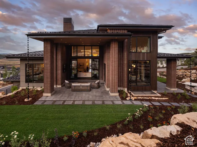 Contemporary exterior featuring brick and wood-paneled accents