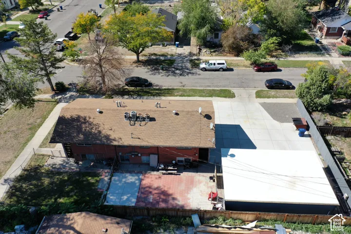 Expansive paved driveway and dedicated parking area