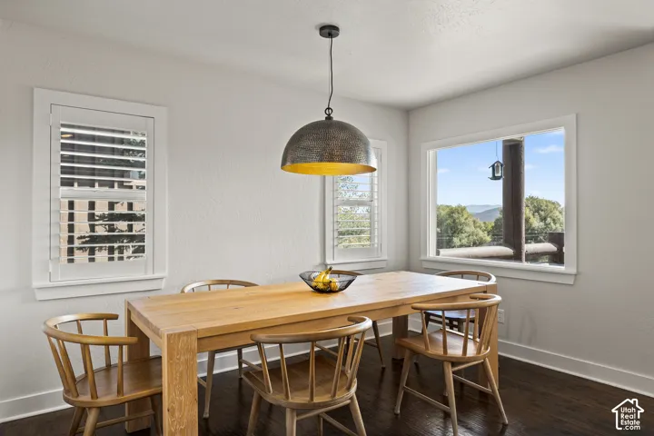 Dark wood-finish flooring complements light-toned walls