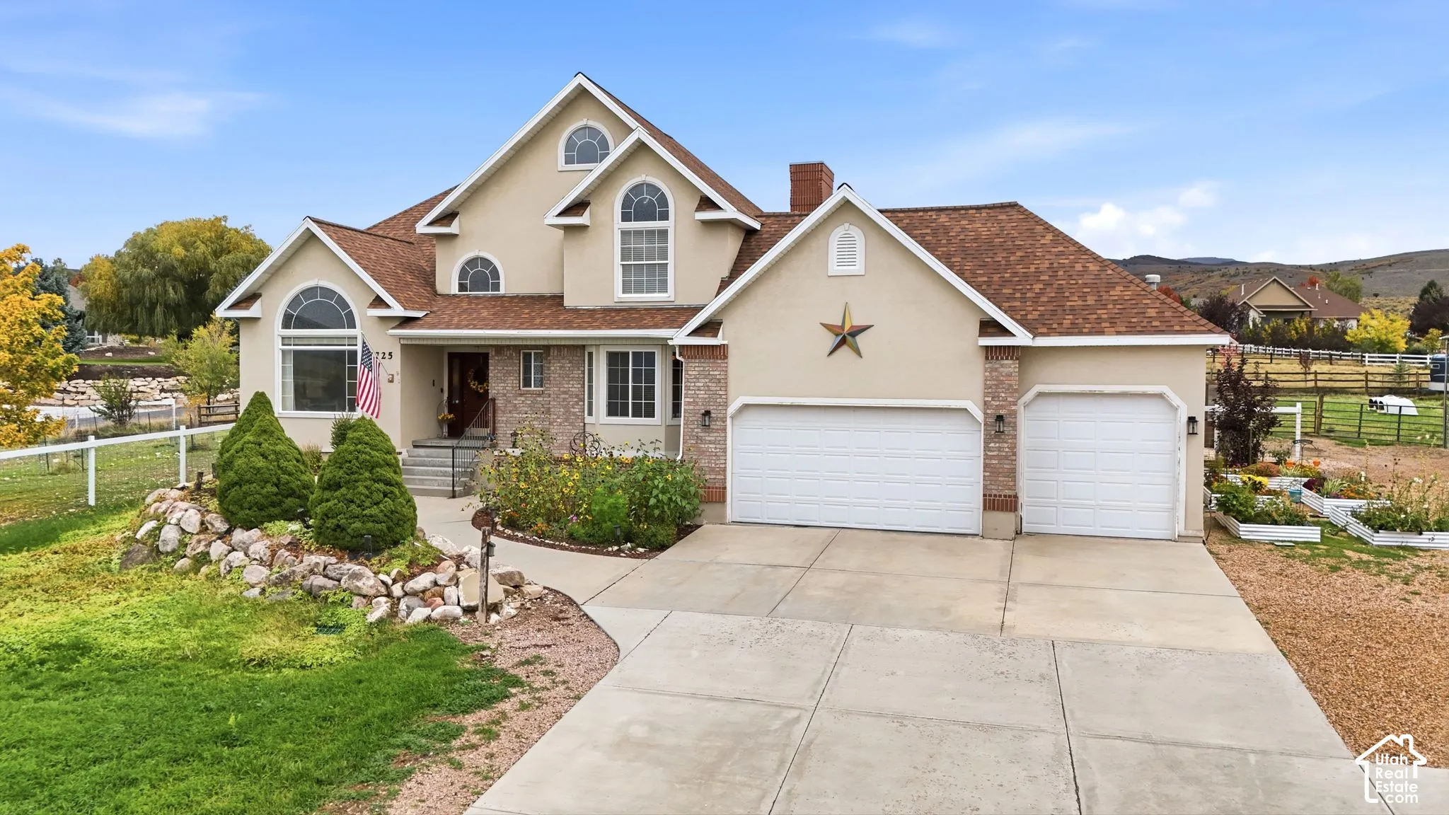 Multi-level exterior featuring a stucco and brick fa
