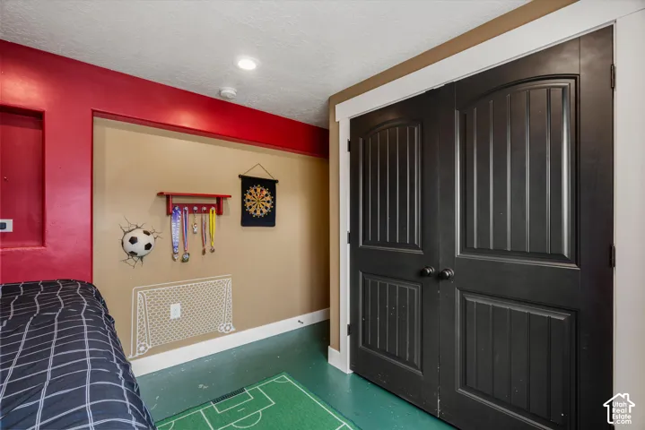Double doors with arched top panels, recessed wall niche, and recessed ceiling lighting