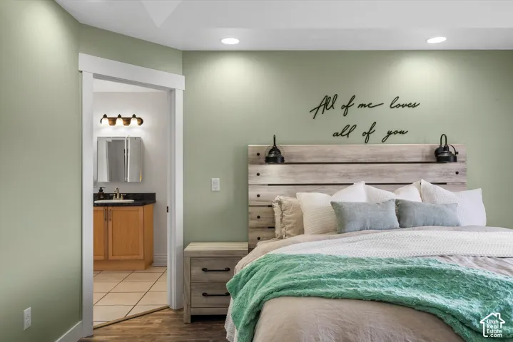 Recessed ceiling lighting, wood-finish flooring, and crisp door trim
