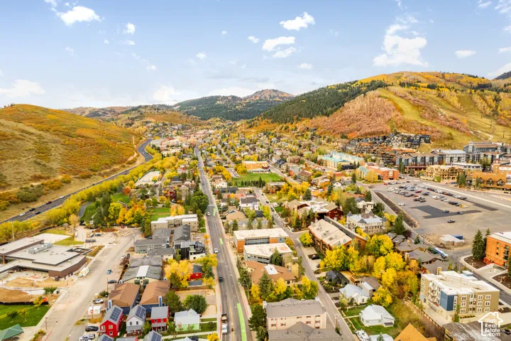 Expansive mountainous terrain with vibrant autumn foliage