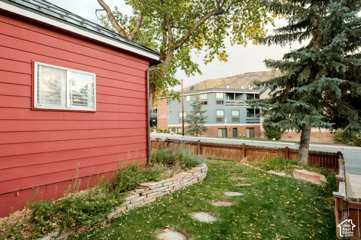 Red horizontal siding exterior with a single pane window