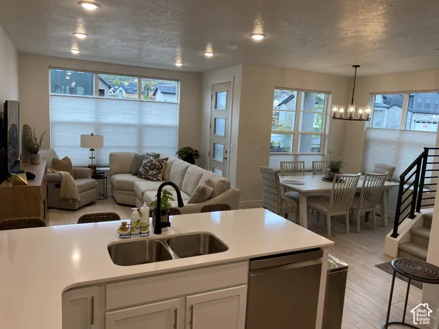 Open-concept living space with recessed lighting and large windows