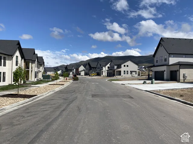 Newly developed neighborhood featuring contemporary residential architecture and a mountain backdrop