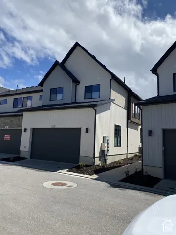 Contemporary exterior design featuring stucco and vertical siding
