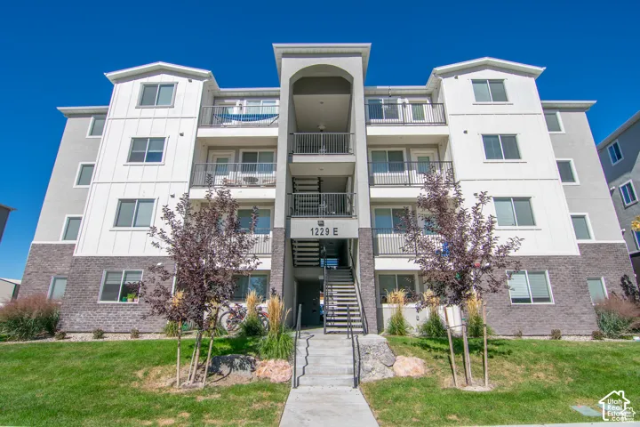 Multi-story exterior featuring private balconies
