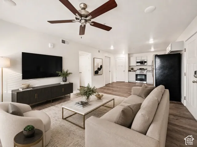 Open-concept floor plan featuring LVP flooring & ceiling fan