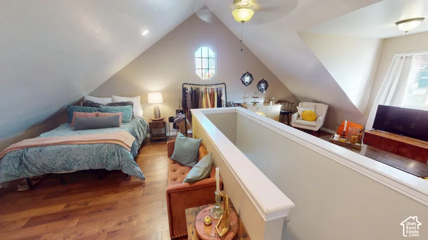 Vaulted ceilings, wood-finish flooring, octagonal accent window, dormer window, and half-wall partitioning