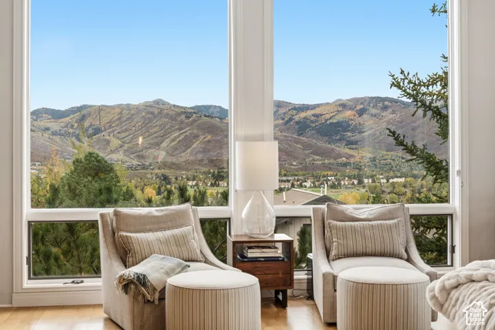 Expansive windows offering mountain scenery