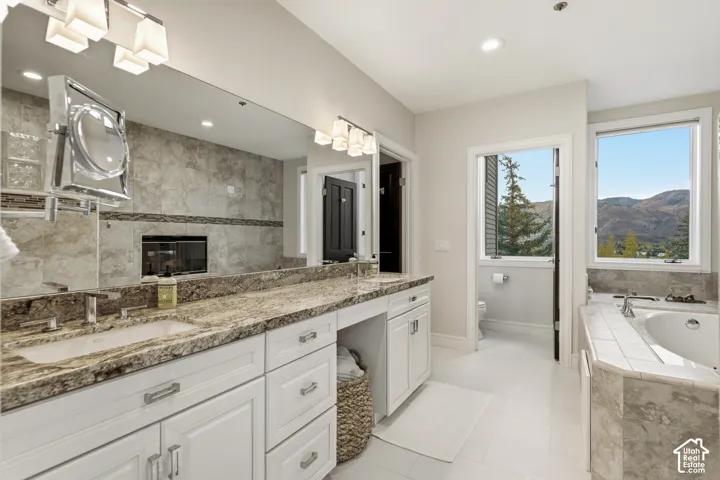 Dual vanity with granite countertops and undermount sinks